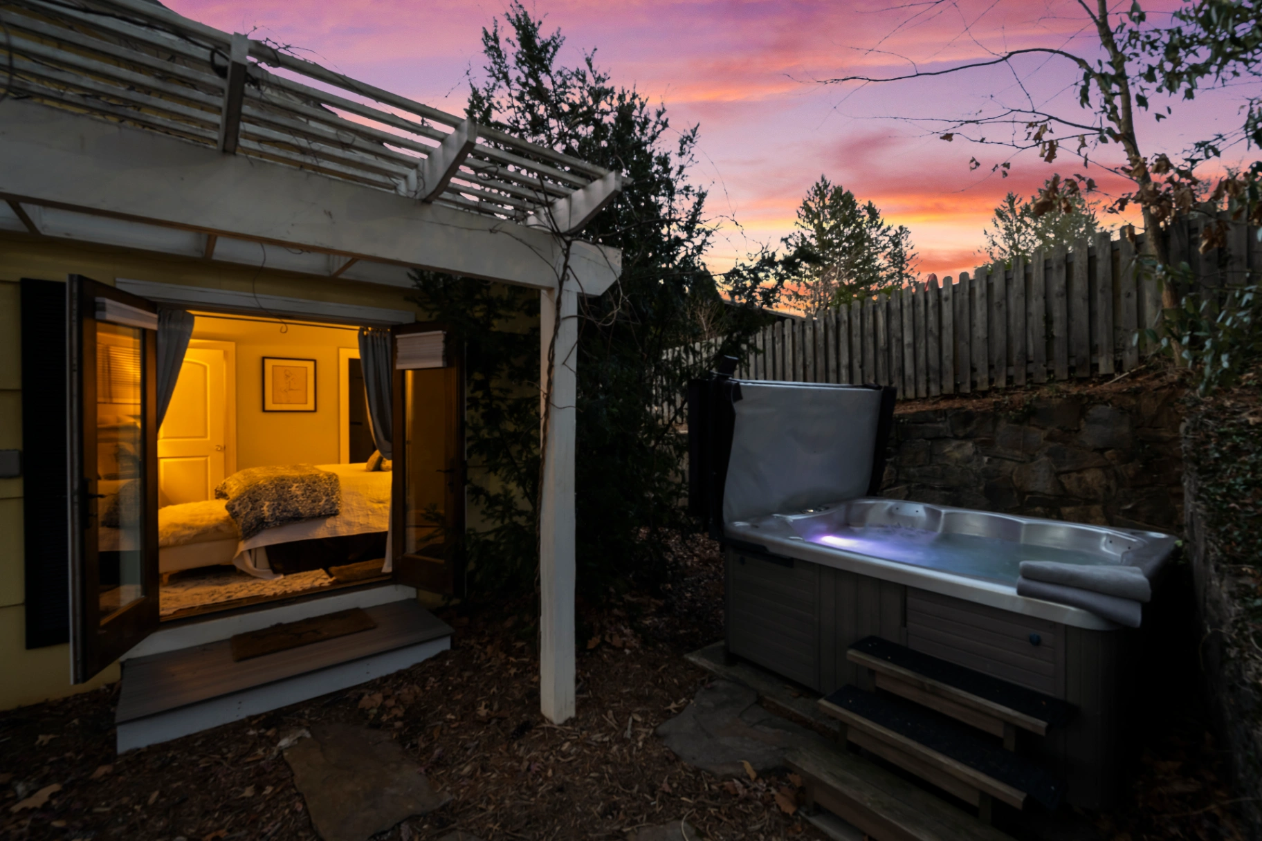 Private hot tub patio at sunset — Asheville vacation rental outdoor spa