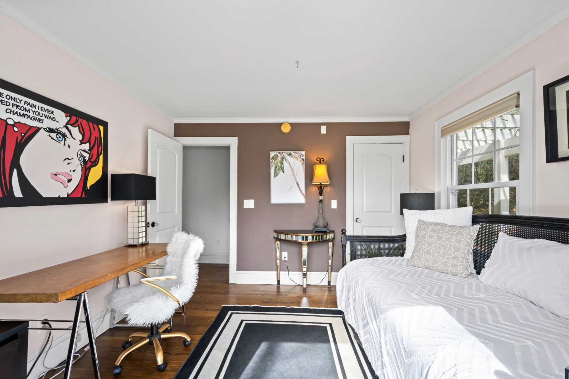 Modern bedroom with desk workspace and daybed — flexible room in Asheville vacation rental